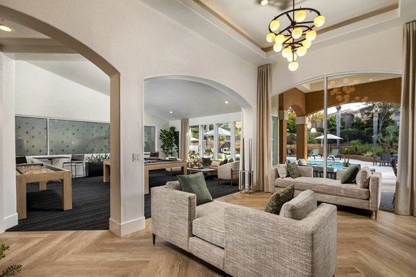 Modern clubhouse with cozy seating and fireplace at Tuscany Ridge Apartments