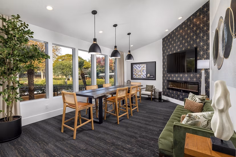 Clubhouse featuring modern design and ample seating at Tuscany Ridge Apartments