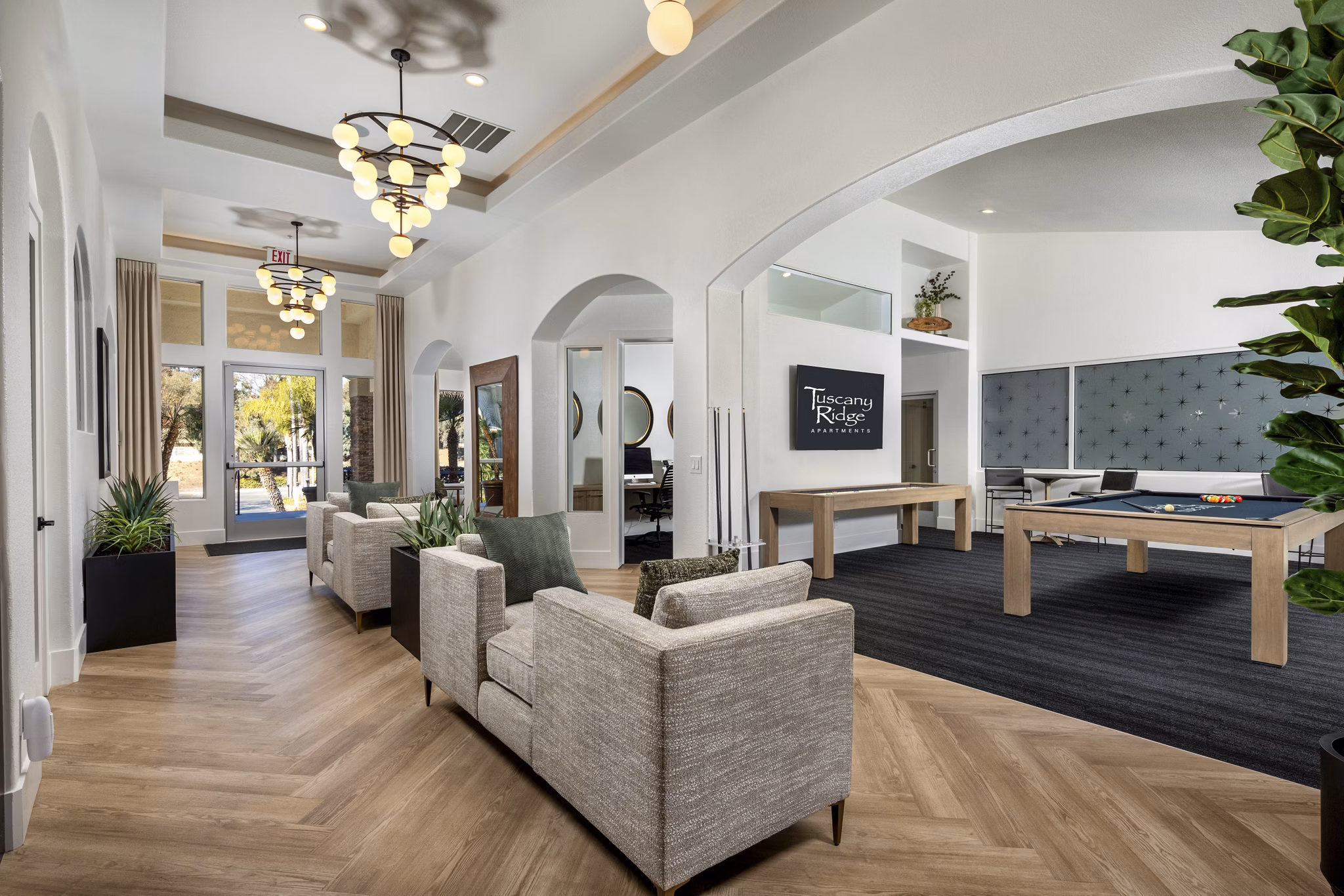 Clubhouse with modern design at Tuscany Ridge Apartments featuring relaxing lounges and community spaces