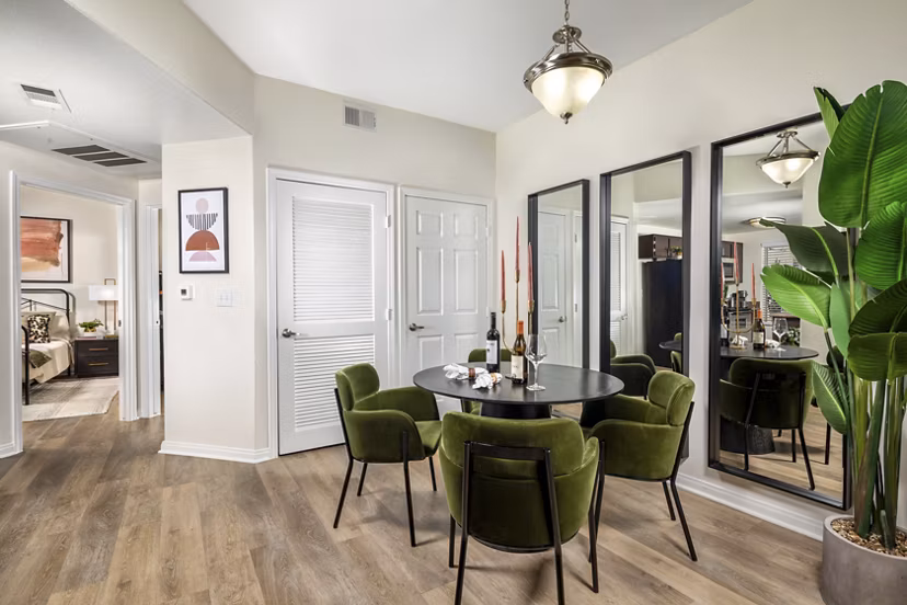 Tuscany Ridge Apartments: Dining area with elegant hardwood floors and modern furniture