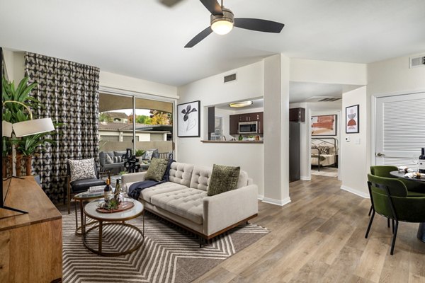 Spacious living room with contemporary decor in Tuscany Ridge Apartments, a luxury property by Greystar