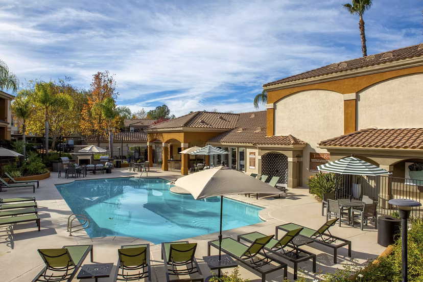Refreshing pool at Tuscany Ridge Apartments offering relaxation and leisure in a luxurious setting, surrounded by scenic views