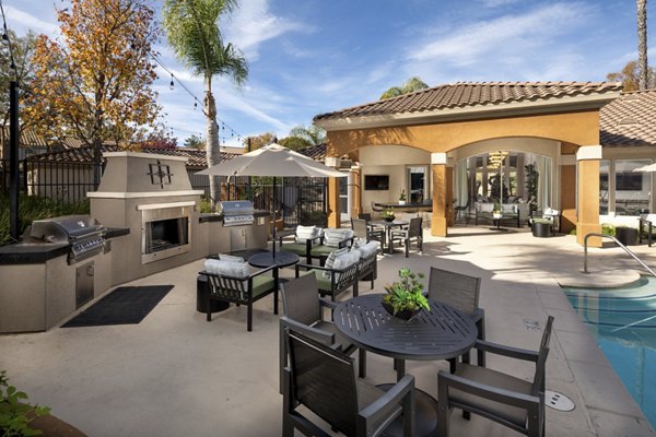 Tuscany Ridge Apartments: Lush courtyard with landscaped gardens and seating areas in a luxury apartment community
