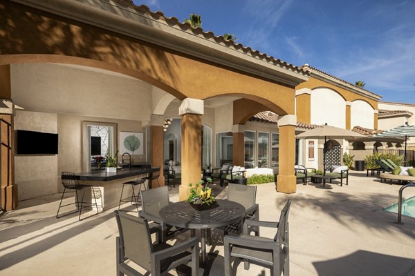 Tuscany Ridge Apartments: Lush courtyard with seating areas in upscale Greystar community