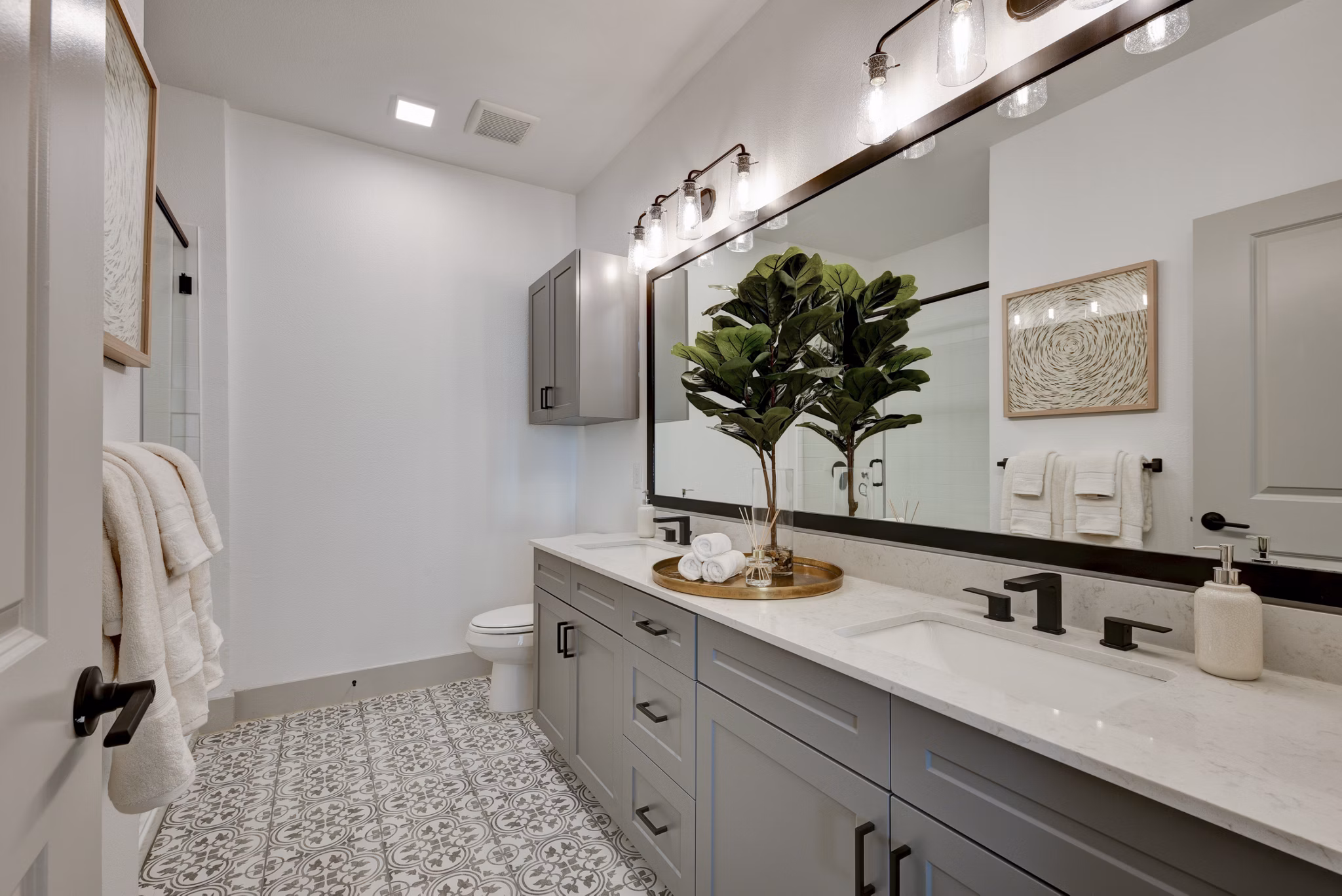 Modern bathroom with sleek fixtures at Arbolada Apartments luxury community