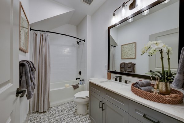 Modern bathroom with sleek fixtures at Arbolada Apartments