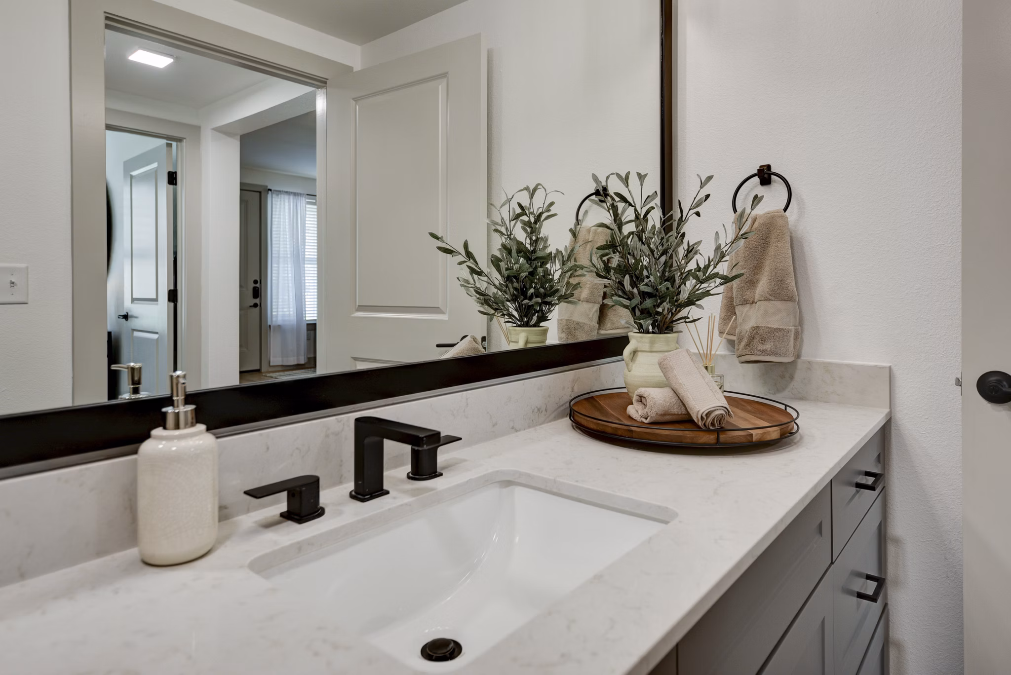Bathroom featuring luxury fixtures and modern design at Arbolada Apartments
