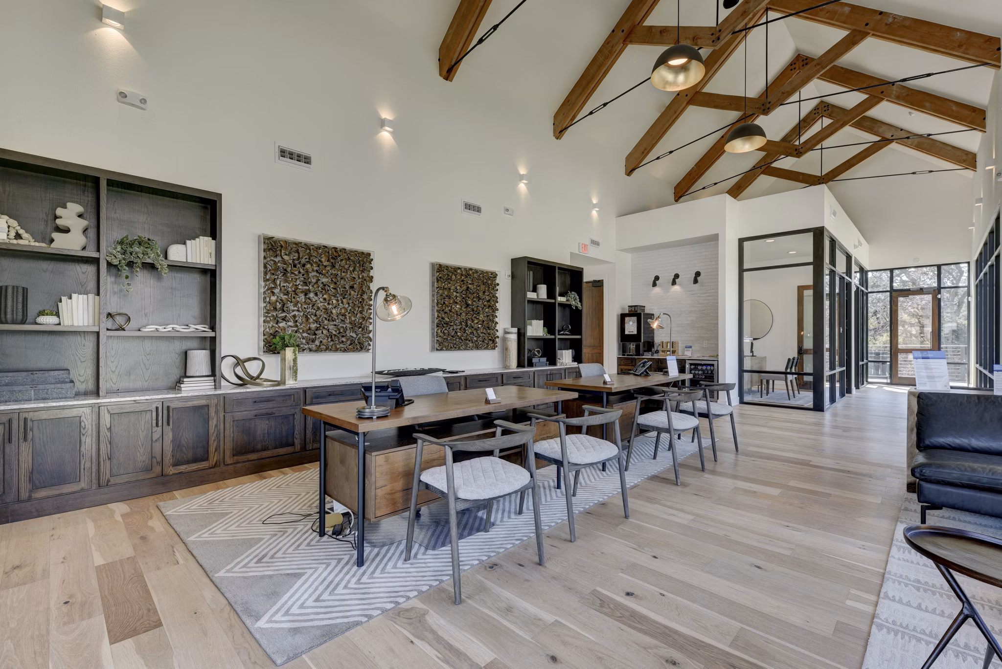 Stylish clubhouse with modern decor at Arbolada Apartments for socializing and events