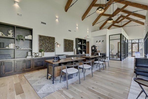 Stylish clubhouse with modern decor at Arbolada Apartments for socializing and events