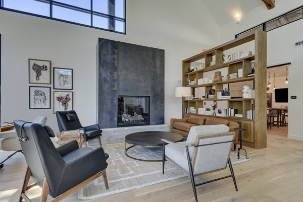 Modern clubhouse with luxurious lounge seating at Arbolada Apartments, offering stylish spaces for socializing and relaxation