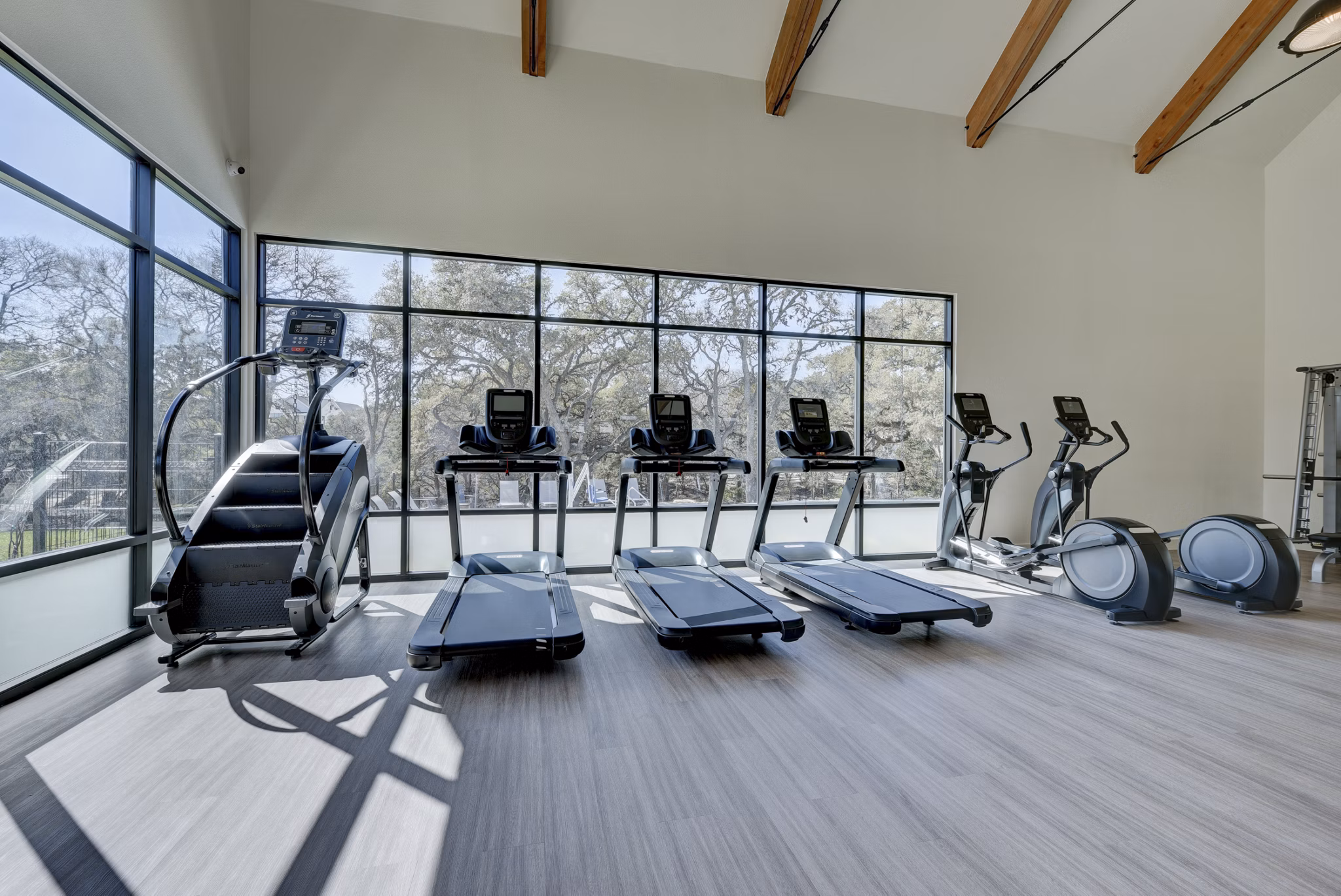 Fitness center with state-of-the-art equipment at Arbolada Apartments, promoting health and wellness in a convenient location