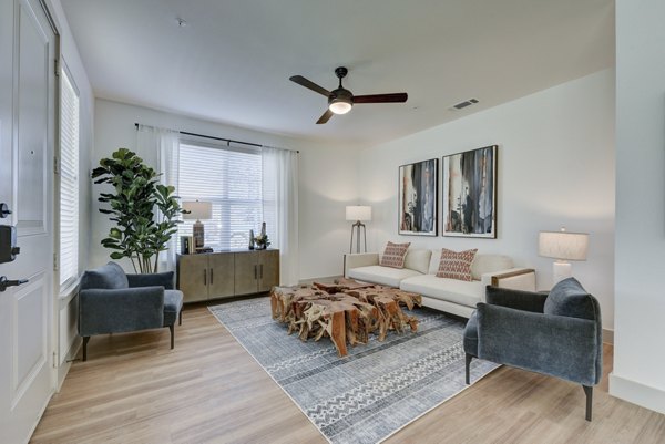 Spacious living room with modern furnishings at Arbolada Apartments, Greystar luxury apartments