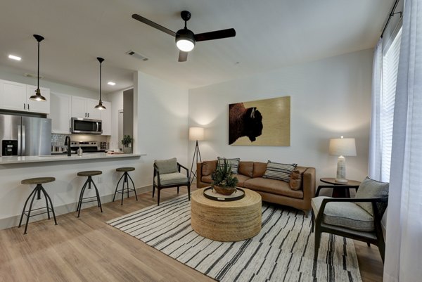 Cozy living room with contemporary furniture at Arbolada Apartments, perfect for relaxation and entertaining