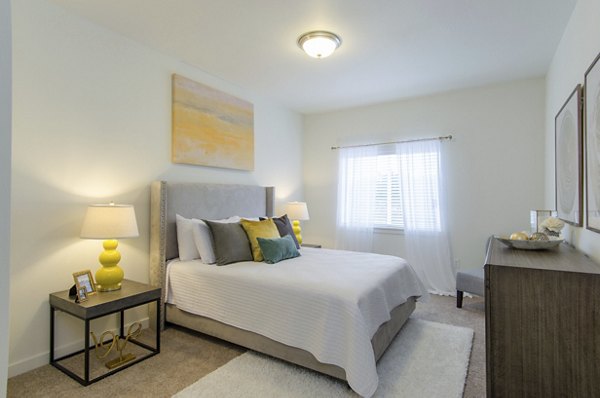 Modern bedroom with sleek furnishings at Britton Place Apartments, luxury living in Lacey, WA.