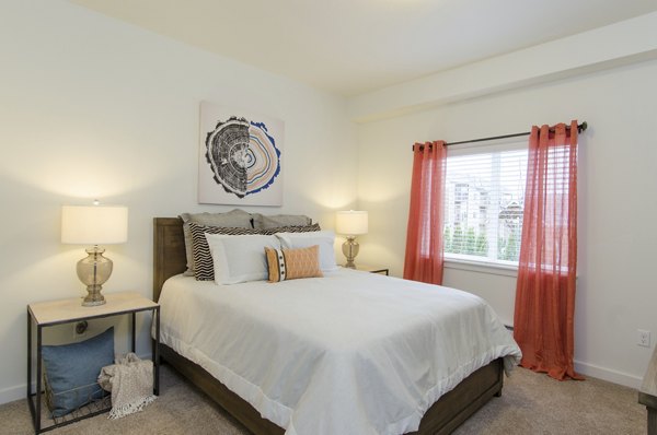 Cozy bedroom with modern furnishings at Britton Place Apartments