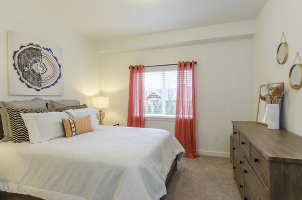 Cozy bedroom with modern furnishings at Britton Place Apartments
