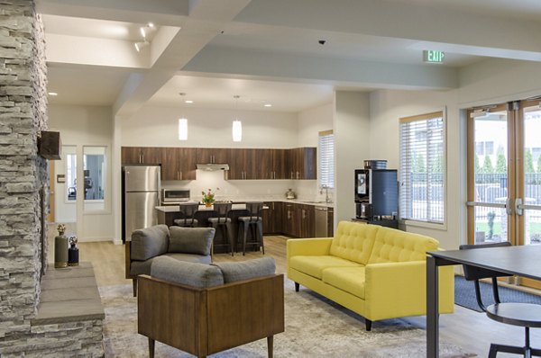 Clubhouse featuring modern design and ample seating at Britton Place Apartments in Lacey