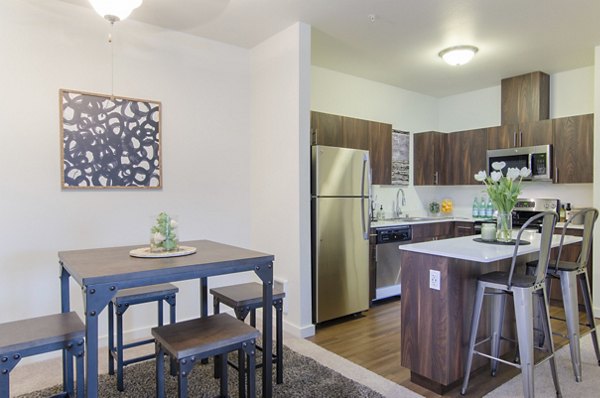 Dining area featuring modern furnishings and elegant lighting at Britton Place Apartments