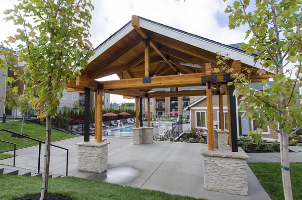 Courtyard with lush landscaping and seating area at Britton Place Apartments, an inviting outdoor space for residents to relax and unwind