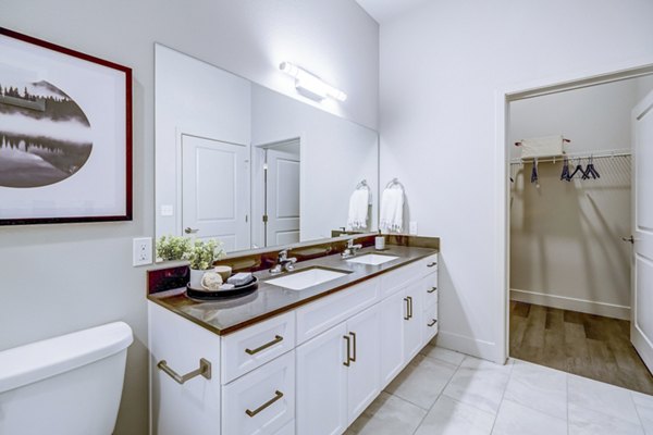 Modern bathroom with sleek fixtures at The Plaza at Pikes Peak Apartments