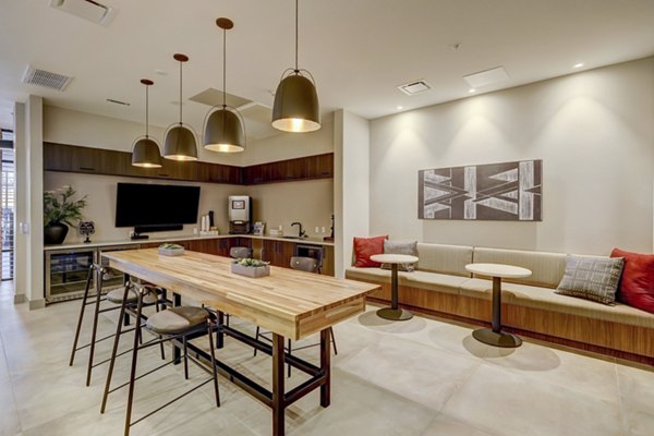 Elegantly designed clubhouse at The Plaza at Pikes Peak Apartments with modern furnishings and social spaces