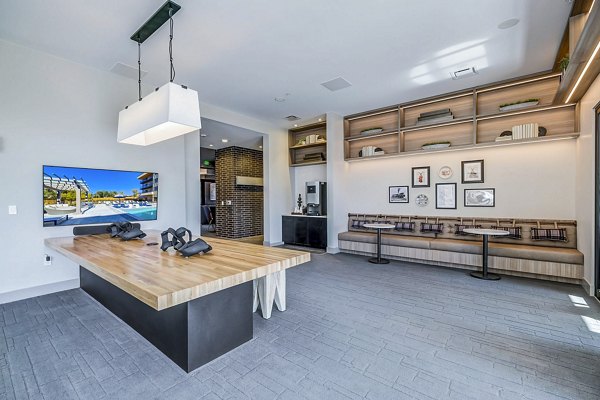 Clubhouse with elegant lounge and modern amenities at The Plaza at Pikes Peak Apartments