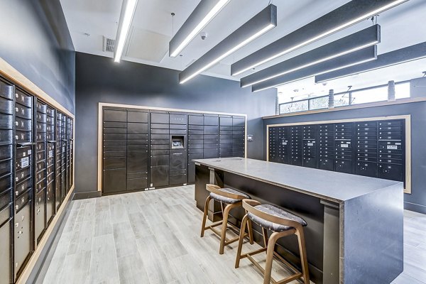 Mail room with secure parcel lockers at The Plaza at Pikes Peak Apartments