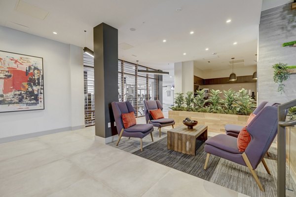 Clubhouse featuring modern interiors at The Plaza at Pikes Peak Apartments