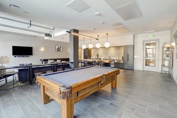 The Plaza at Pikes Peak: Stylish clubhouse with modern design and comfortable seating at luxury apartments in Colorado Springs