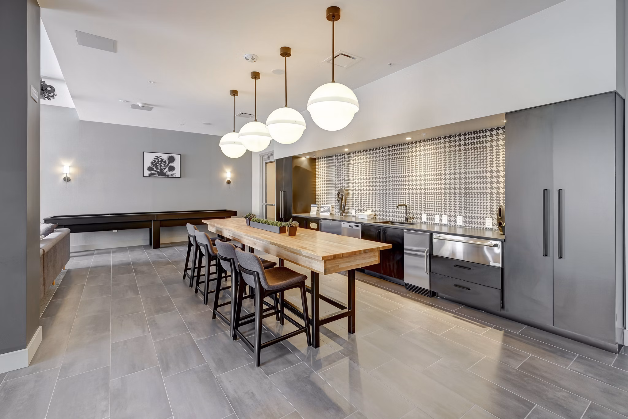 Clubhouse at The Plaza at Pikes Peak Apartments featuring contemporary design and ample seating areas