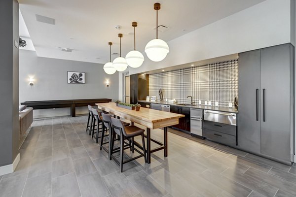 Clubhouse at The Plaza at Pikes Peak Apartments featuring contemporary design and ample seating areas