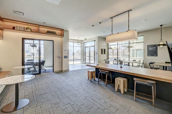 Elegant clubhouse with cozy seating and modern decor at The Plaza at Pikes Peak Apartments