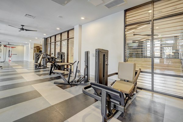 Modern fitness center with state-of-the-art equipment at The Plaza at Pikes Peak Apartments, offering luxury amenities for active lifestyles