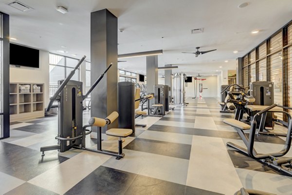 Modern fitness center featuring state-of-the-art equipment at The Plaza at Pikes Peak Apartments