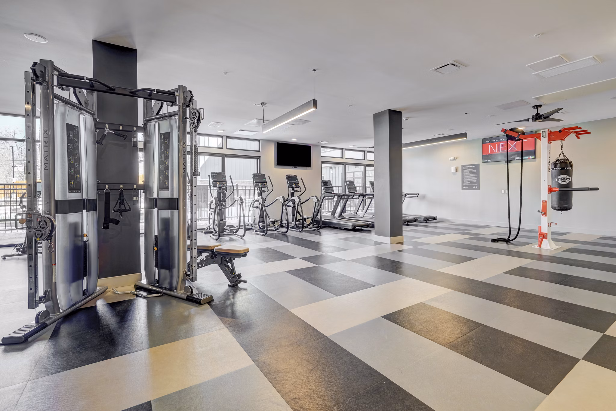 State-of-the-art fitness center with modern equipment at The Plaza at Pikes Peak Apartments