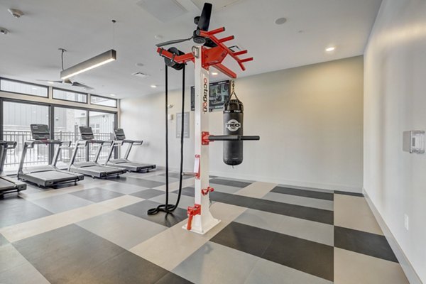 State-of-the-art fitness center at The Plaza at Pikes Peak Apartments featuring modern equipment for an active lifestyle