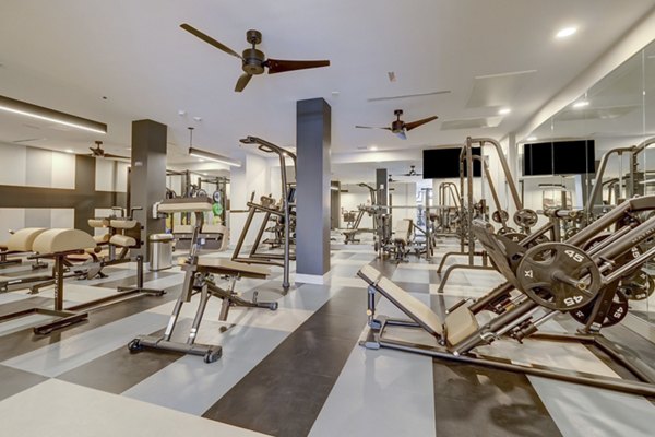 Fitness center with modern gym equipment at The Plaza at Pikes Peak Apartments
