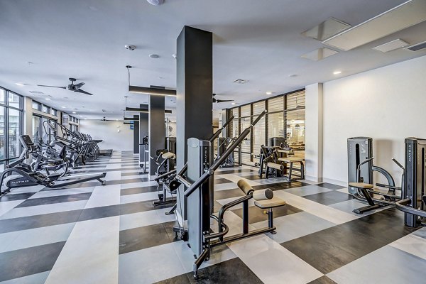 Yoga and spin studio at The Plaza at Pikes Peak Apartments featuring modern equipment and spacious layout