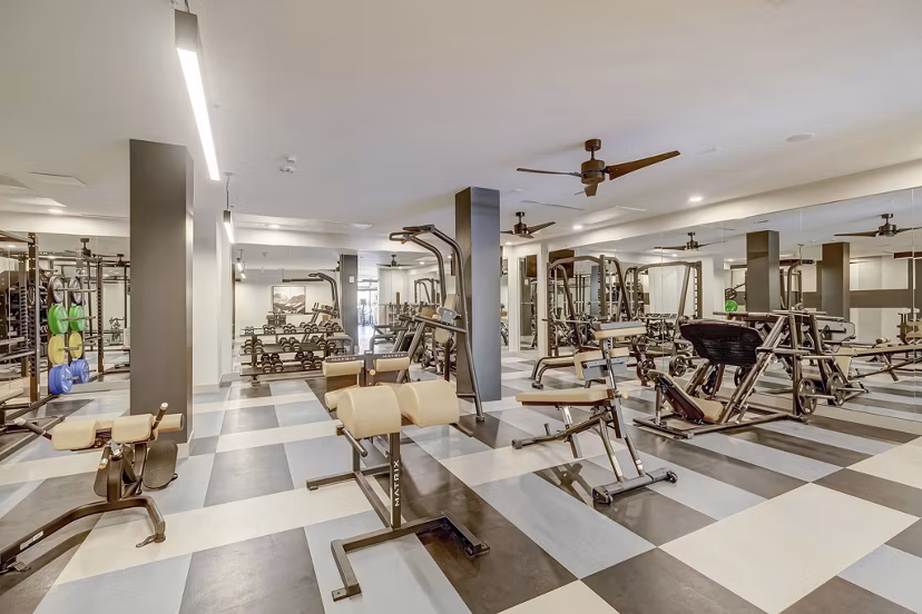fitness center at The Plaza at Pikes Peak Apartments 
