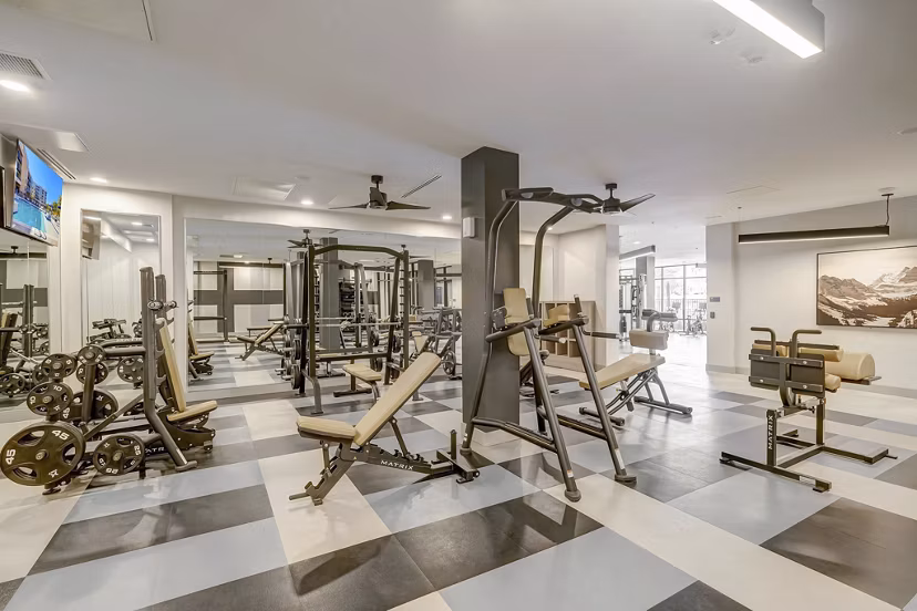 fitness center at The Plaza at Pikes Peak Apartments 