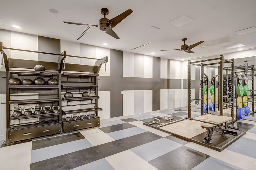 fitness center at The Plaza at Pikes Peak Apartments 