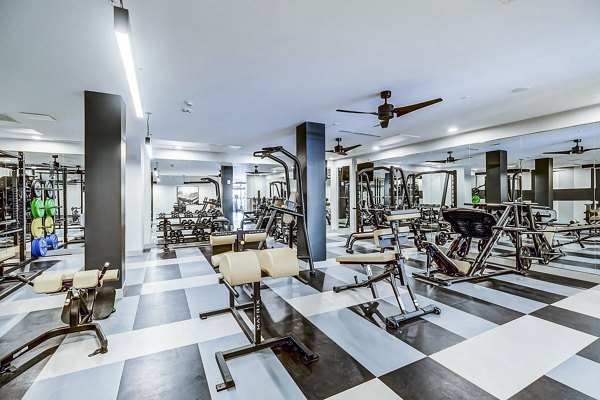 State-of-the-art fitness center with modern equipment at The Plaza at Pikes Peak Apartments, offering luxury living and active lifestyle options