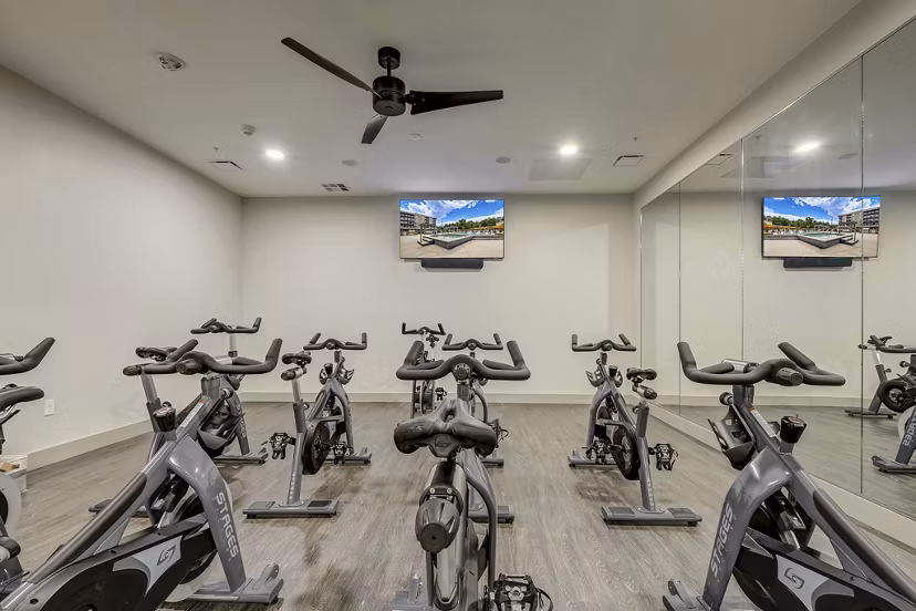 fitness center at The Plaza at Pikes Peak Apartments 