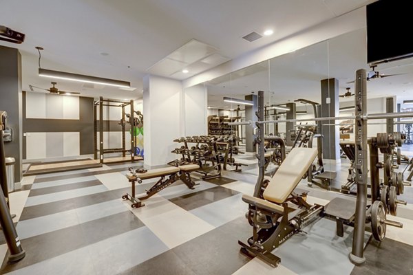 Modern fitness center featuring top-of-the-line equipment at The Plaza at Pikes Peak Apartments