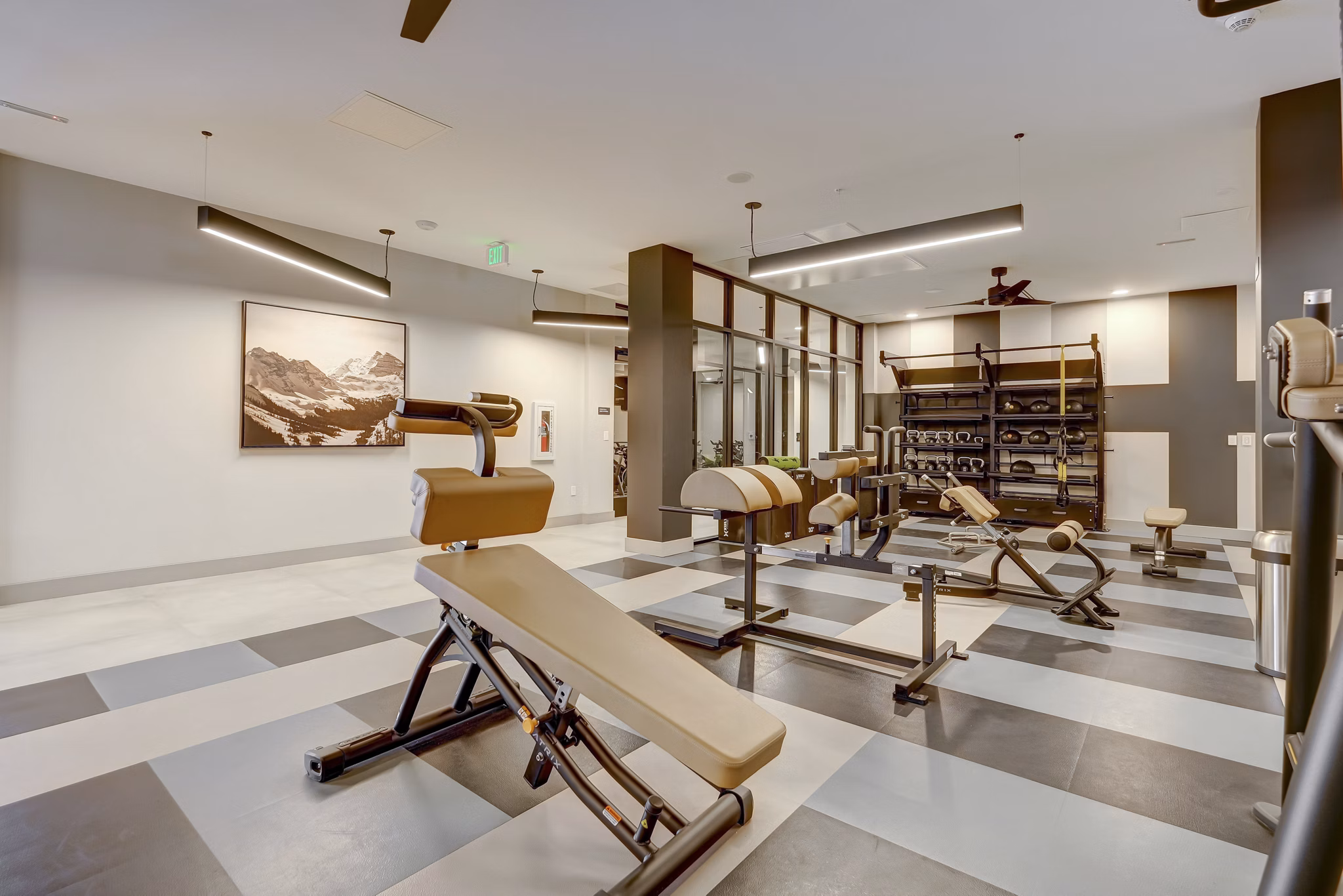Modern fitness center with state-of-the-art equipment in The Plaza at Pikes Peak Apartments