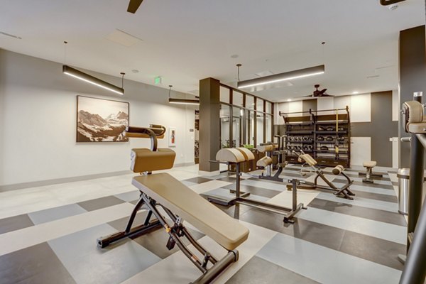 Modern fitness center with state-of-the-art equipment in The Plaza at Pikes Peak Apartments