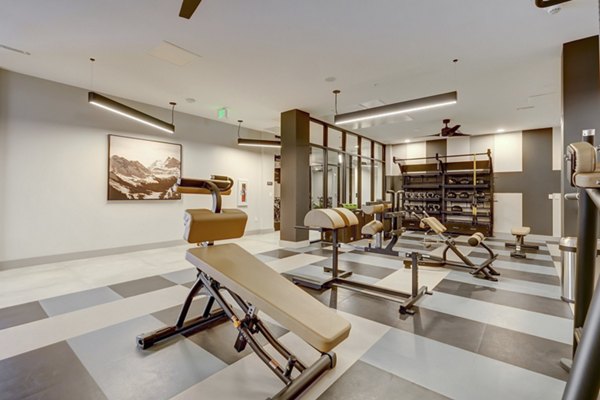 fitness center at The Plaza at Pikes Peak Apartments