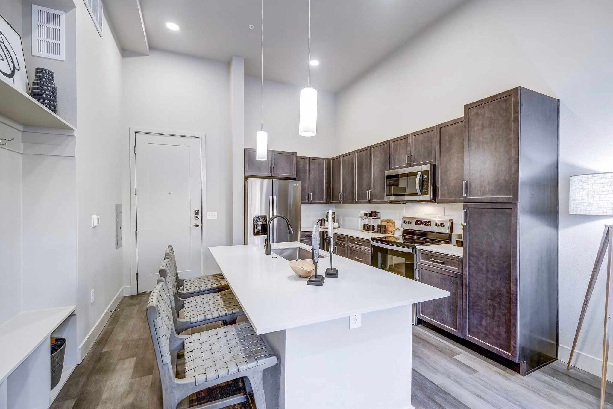 Sleek kitchen with stainless steel appliances at The Plaza at Pikes Peak Apartments