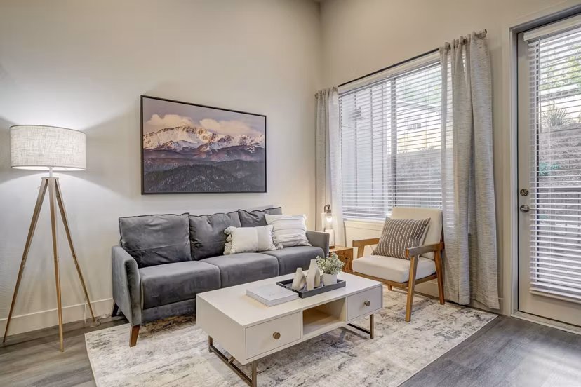 living room at The Plaza at Pikes Peak Apartments 