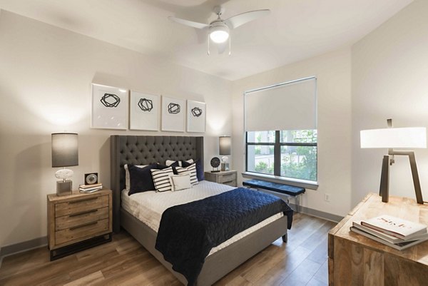 Modern bedroom with elegant furnishings and city views at Seville Uptown Apartments